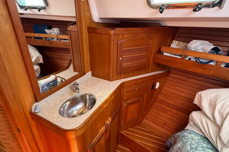 Slide: The Image of Luxurious wooden interior of 2009 Sabre 386 yacht with sink and storage. - 42