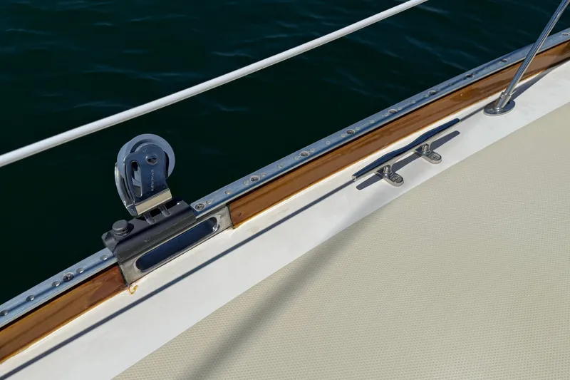 Slide: The Image of Deck detail of a 2009 Sabre 386 sailboat, featuring cleat and pulley system. - 73