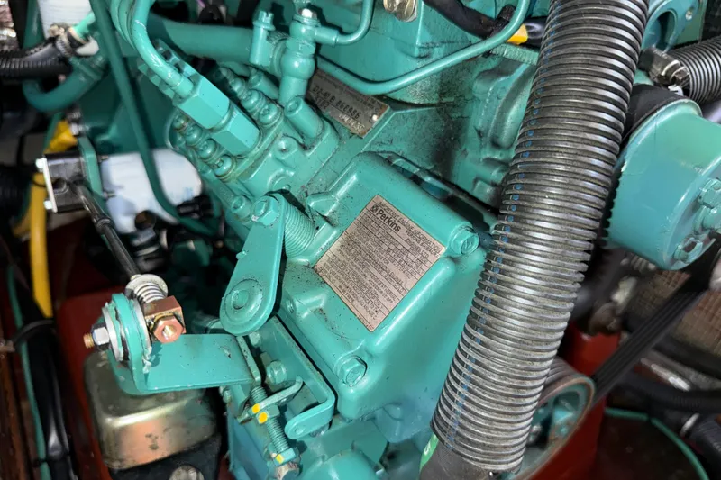 Slide: The Image of Close-up of a 2009 Sabre 386 engine component with visible Perkins label. - 95