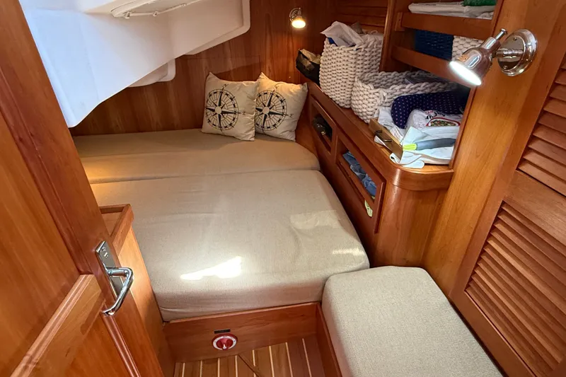 Slide: The Image of Cozy cabin interior of 2009 Sabre 386 sailboat with wooden finish and soft lighting. - 58