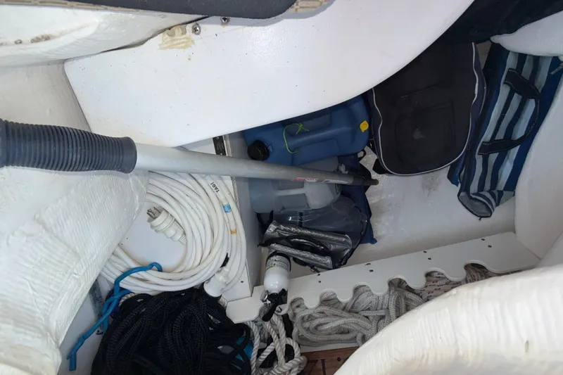 Slide: The Image of Storage compartment on a 2009 Sabre 386 sailboat with ropes and equipment. - 92