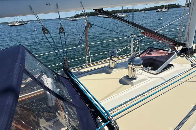 Slide: The Image of Sailboat deck view, Sabre 386, 2009 model, with ocean and moored boats in background. - 70