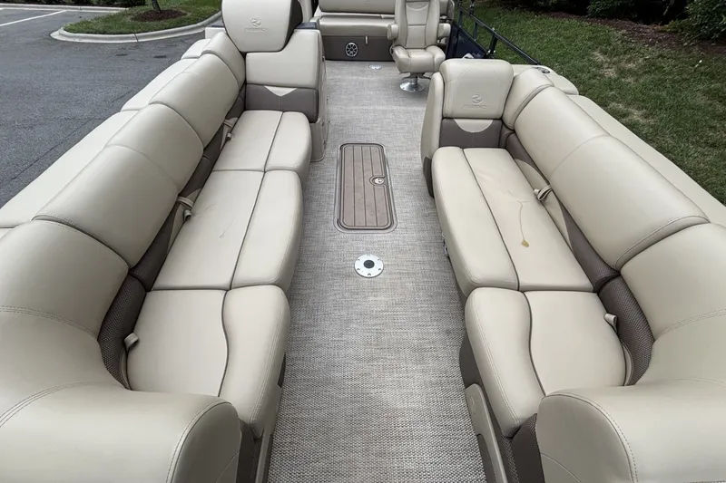 Slide: The Image of Luxurious interior of 2025 Regency 250DL3 pontoon boat with beige seating. - 18