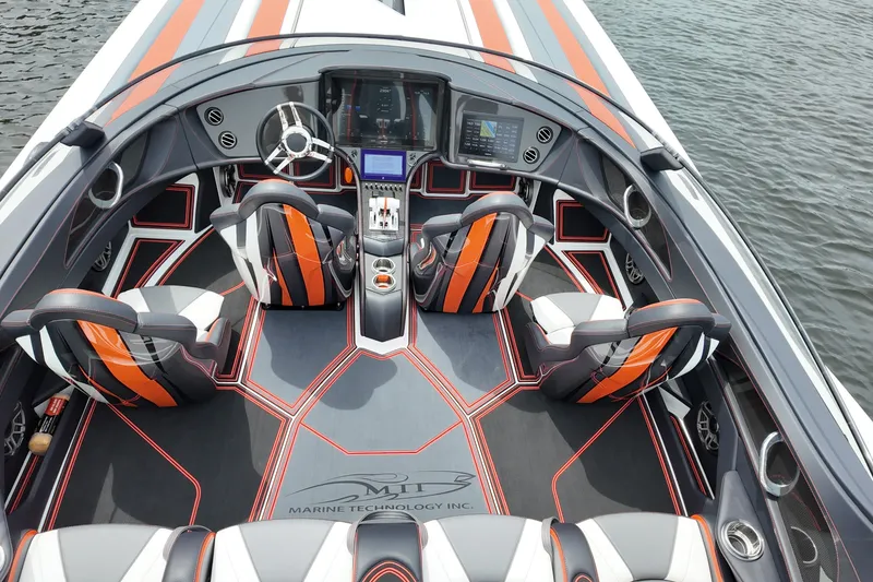 Slide: The Image of Luxurious 2024 MTI 440X boat interior with sleek design and advanced navigation system. - 14