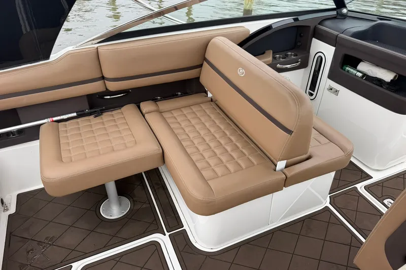 Slide: The Image of Luxurious seating on 2020 Cobalt 30SC boat with tan upholstery and modern design. - 19