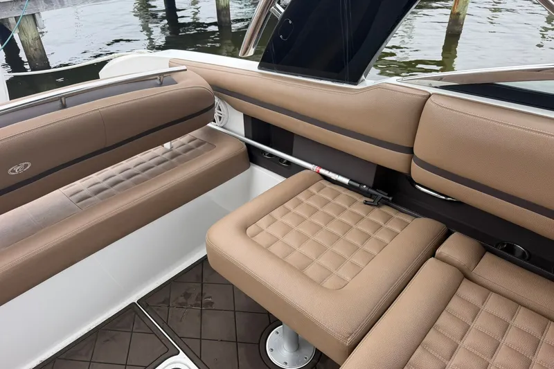 Slide: The Image of Luxurious seating on a 2020 Cobalt 30SC boat, featuring tan upholstery and quilted design. - 20