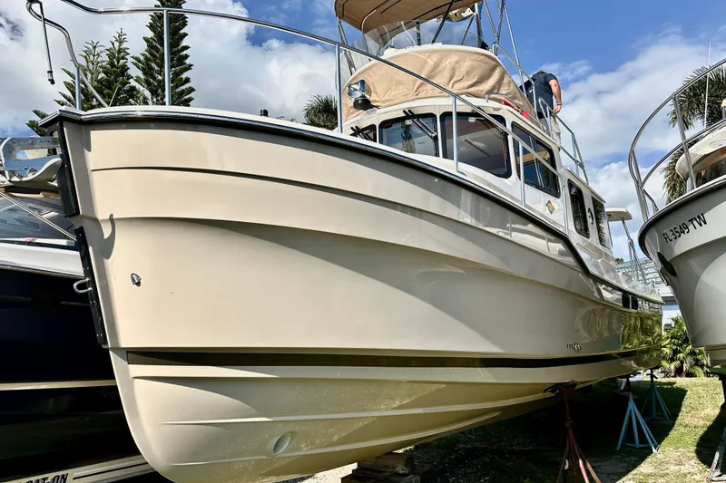 Slide: The Image of 2026 Ranger Tugs R-31 CB boat on display, showcasing sleek design and craftsmanship. - 1