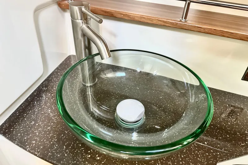 Slide: The Image of Modern glass sink and faucet on Ranger Tugs R-31 CB, 2026 model. - 35