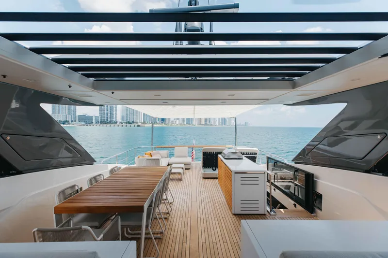 Slide: The Image of Luxurious 2024 Sanlorenzo SL90A yacht deck with dining area and ocean view. - 78