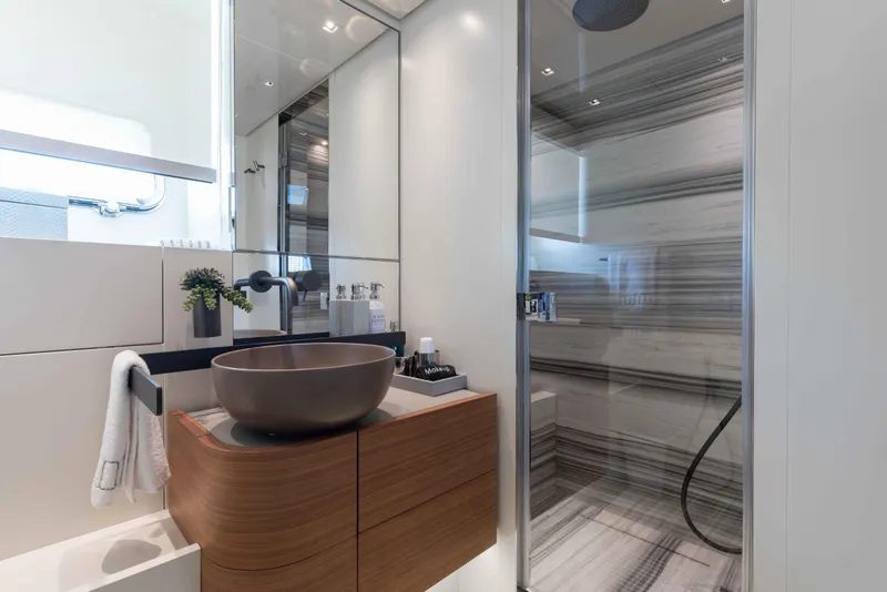 Slide: The Image of Luxurious bathroom in 2024 Sanlorenzo SL90A yacht with modern fixtures and elegant design. - 56