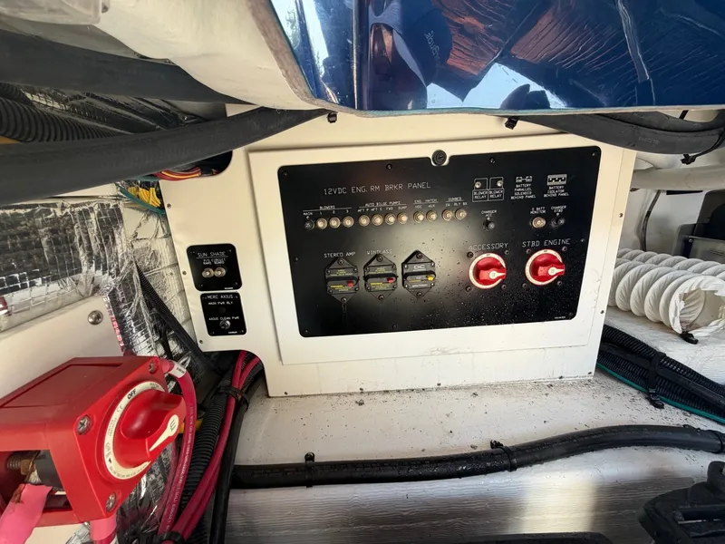Slide: The Image of The image shows the electrical control panel of a 2022 Cruisers Yachts 338 CX South Beach Bow Rider. - 21