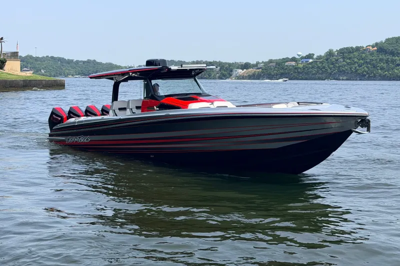 The Image of 2027 Nor-Tech 42 Eleven boat on water, featuring sleek design and multiple outboard engines. - 1