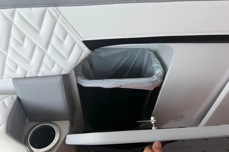 Slide: The Image of Luxury interior of 2027 Nor-Tech 42 Eleven with built-in trash compartment. - 42
