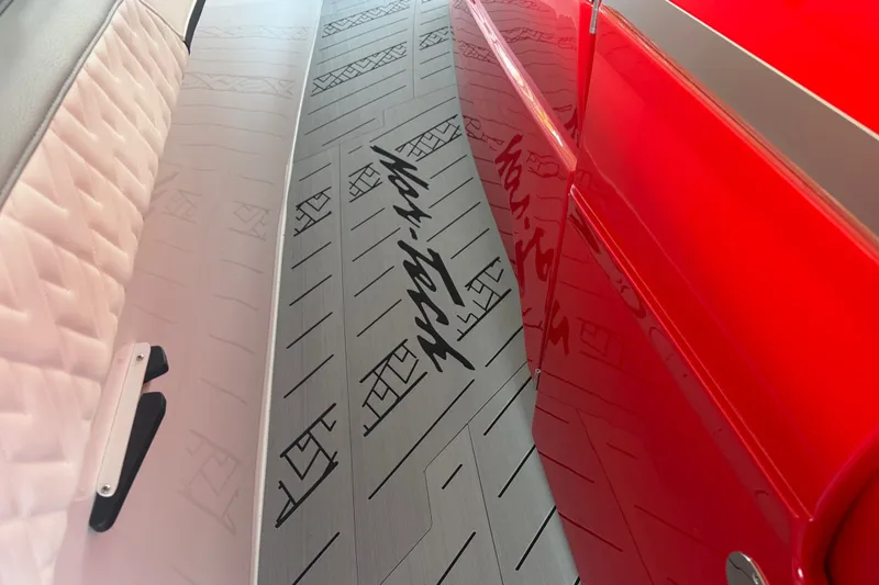 Slide: The Image of Interior of 2027 Nor-Tech 42 Eleven boat with sleek red and white design. - 53