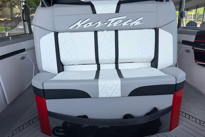 Slide: The Image of Luxurious seating on 2027 Nor-Tech 42 Eleven boat, featuring stylish white and black upholstery. - 39