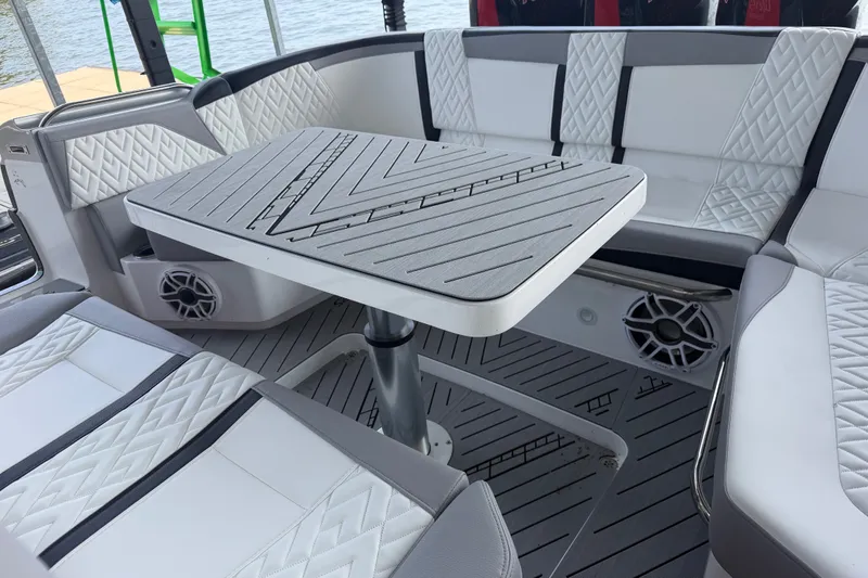 Slide: The Image of Luxurious seating area on a 2027 Nor-Tech 42 Eleven boat with stylish upholstery and table. - 60