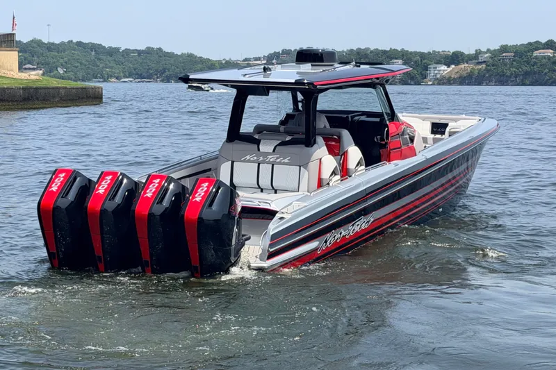 Slide: The Image of 2027 Nor-Tech 42 Eleven boat with quad engines on a scenic lake. - 19