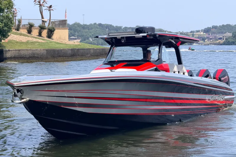 Slide: The Image of 2027 Nor-Tech 42 Eleven boat with sleek design on a sunny day. - 8