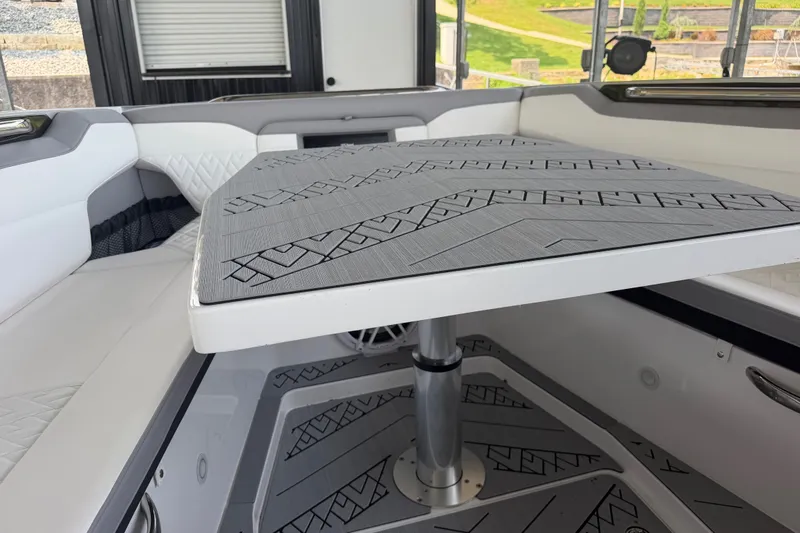 Slide: The Image of Interior of 2027 Nor-Tech 42 Eleven boat with modern seating and patterned table. - 66