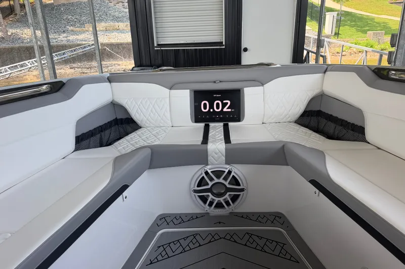 Slide: The Image of Luxurious interior of 2027 Nor-Tech 42 Eleven boat with modern seating and digital display. - 61