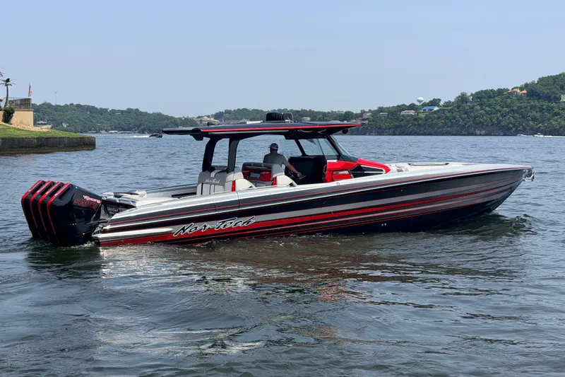 Slide: The Image of 2027 Nor-Tech 42 Eleven boat on water, featuring sleek design and powerful engines. - 25