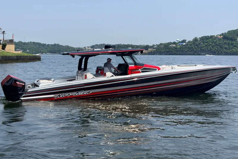 Slide: The Image of 2027 Nor-Tech 42 Eleven boat on a lake, featuring sleek design and vibrant colors. - 30