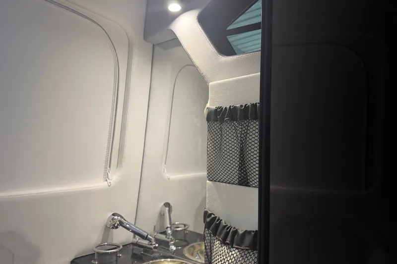 Slide: The Image of Interior of 2027 Nor-Tech 42 Eleven boat with modern sink and storage. - 71