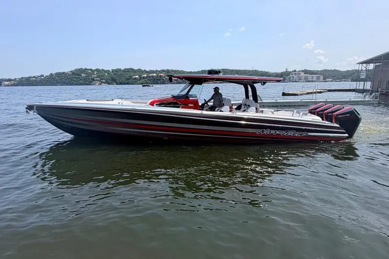 Slide: The Image of 2027 Nor-Tech 42 Eleven boat on water, featuring sleek design and powerful engines. - 28