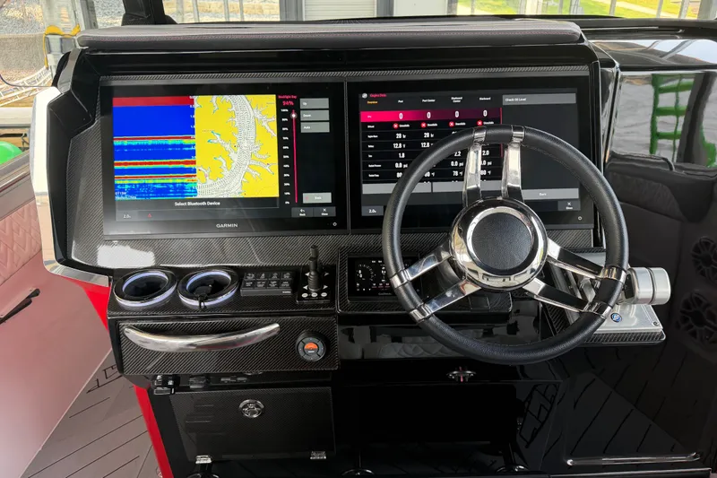 Slide: The Image of Dashboard of 2027 Nor-Tech 42 Eleven boat with advanced navigation displays. - 49