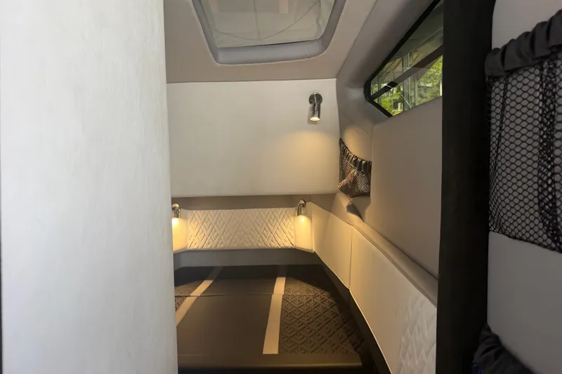 Slide: The Image of Interior cabin of 2027 Nor-Tech 42 Eleven boat, featuring modern lighting and sleek design. - 68