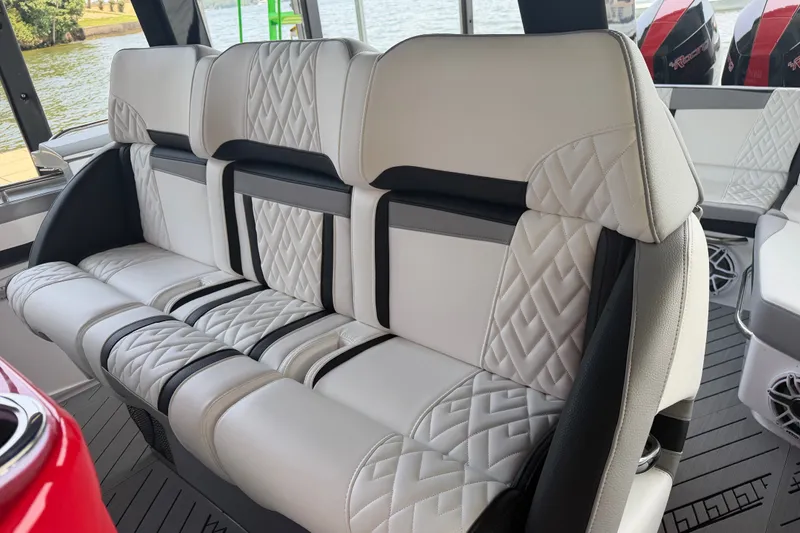 Slide: The Image of Luxurious seating in 2027 Nor-Tech 42 Eleven boat, featuring elegant quilted upholstery. - 44