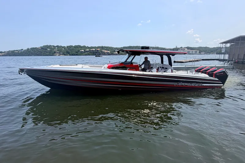 Slide: The Image of 2027 Nor-Tech 42 Eleven boat on calm water, featuring sleek design and powerful engines. - 29