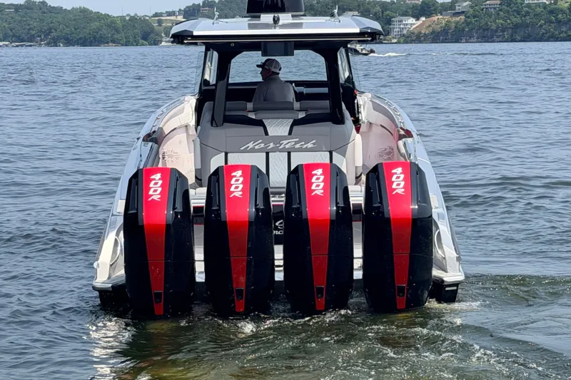 Slide: The Image of 2027 Nor-Tech 42 Eleven boat with four 400R engines on a lake. - 31