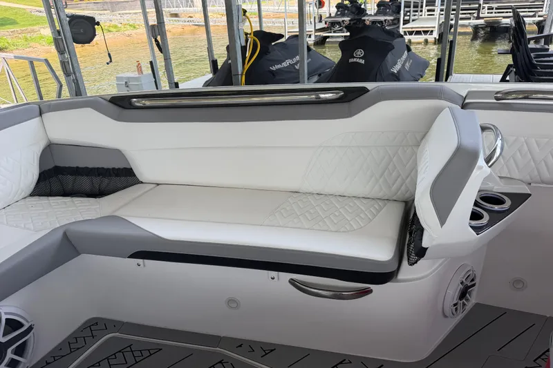 Slide: The Image of Luxurious seating on 2027 Nor-Tech 42 Eleven boat, featuring white and gray upholstery. - 65