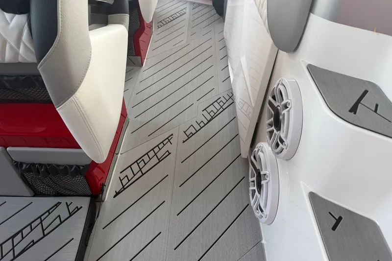Slide: The Image of Interior of 2027 Nor-Tech 42 Eleven boat with stylish seating and modern speaker system. - 52