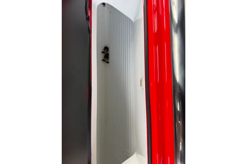 Slide: The Image of Interior view of 2027 Nor-Tech 42 Eleven boat with sleek red and black design. - 47