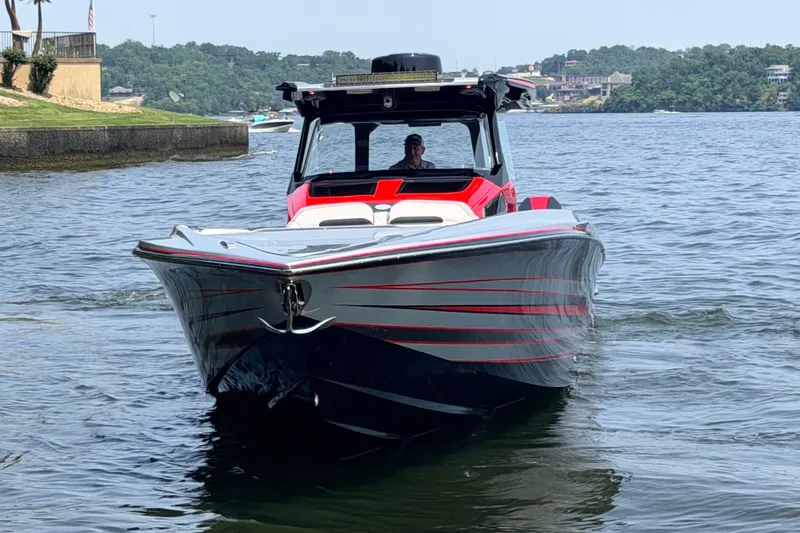 Slide: The Image of 2027 Nor-Tech 42 Eleven boat on a lake, featuring sleek design and vibrant red accents. - 7