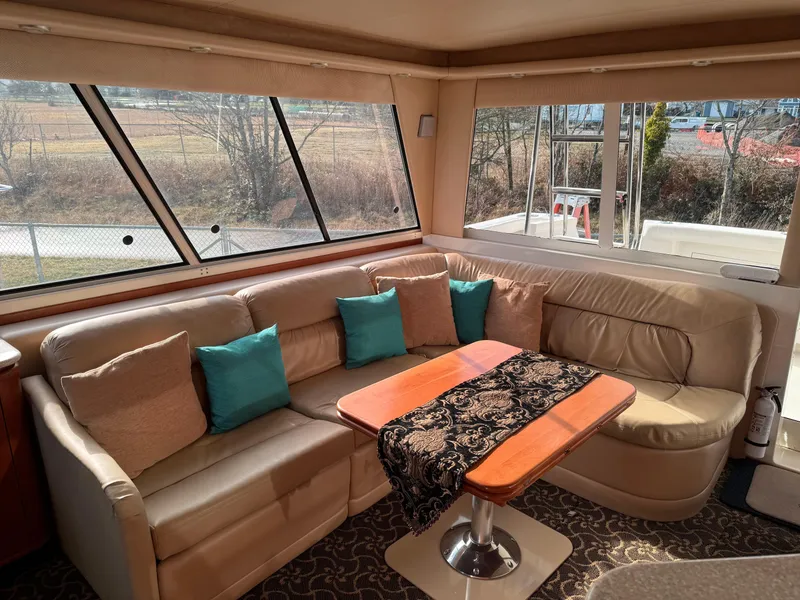 Slide: The Image of Luxurious interior of 2003 Meridian 490 Pilothouse with plush seating and elegant decor. - 4