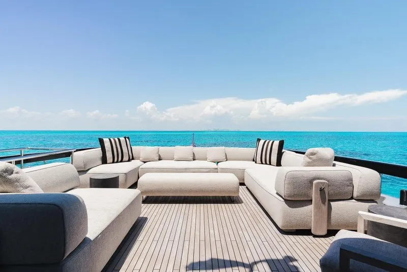 Slide: The Image of Luxurious 2022 Riva 90' Argo yacht deck with elegant seating and stunning ocean view. - 37