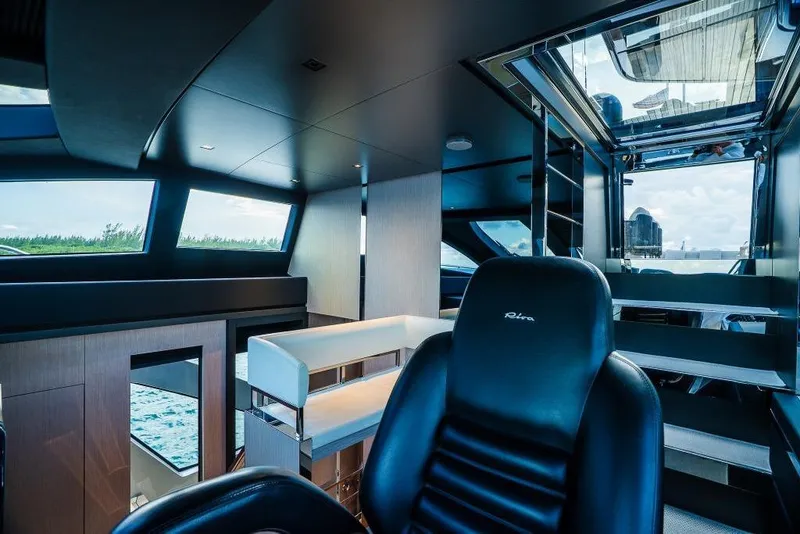 Slide: The Image of Luxurious interior of 2022 Riva 90' Argo yacht with sleek design and modern furnishings. - 31