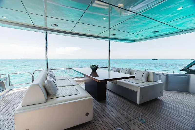 Slide: The Image of Luxurious 2022 Riva 90' Argo yacht deck with elegant seating and ocean view. - 8