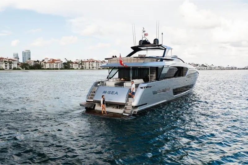 Slide: The Image of Luxury 2022 Riva 90' Argo yacht cruising near coastal residences. - 57