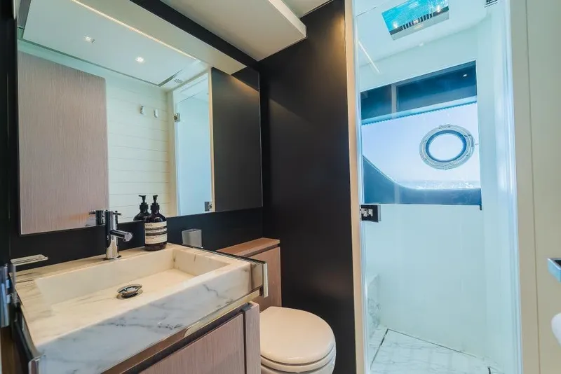 Slide: The Image of Luxurious bathroom interior on 2022 Riva 90' Argo yacht with modern fixtures and marble accents. - 27