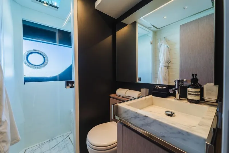 Slide: The Image of Luxurious bathroom interior on 2022 Riva 90' Argo yacht with modern fixtures and elegant design. - 29
