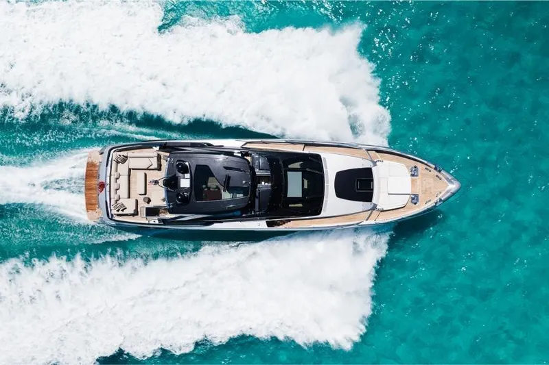 Slide: The Image of Aerial view of 2022 Riva 90' Argo yacht cruising in turquoise waters. - 55
