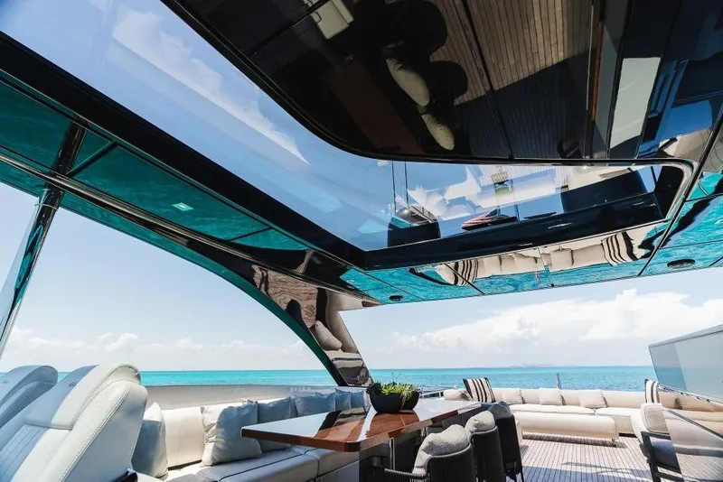 Slide: The Image of Luxurious interior of 2022 Riva 90' Argo yacht with ocean view and modern seating. - 36