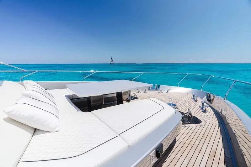 Slide: The Image of Luxurious 2022 Riva 90' Argo yacht deck with ocean view and sunbathing area. - 49