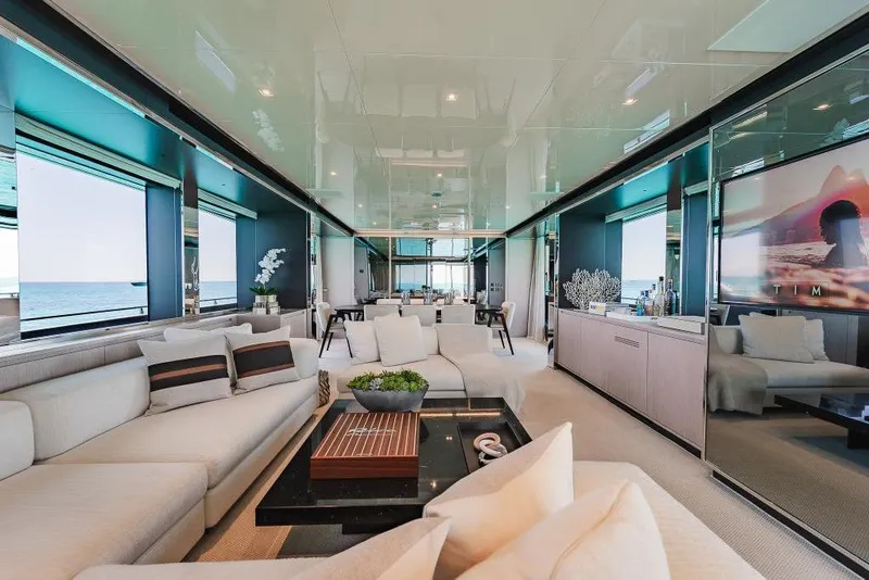Slide: The Image of Luxurious interior of 2022 Riva 90' Argo yacht with elegant seating and ocean views. - 13