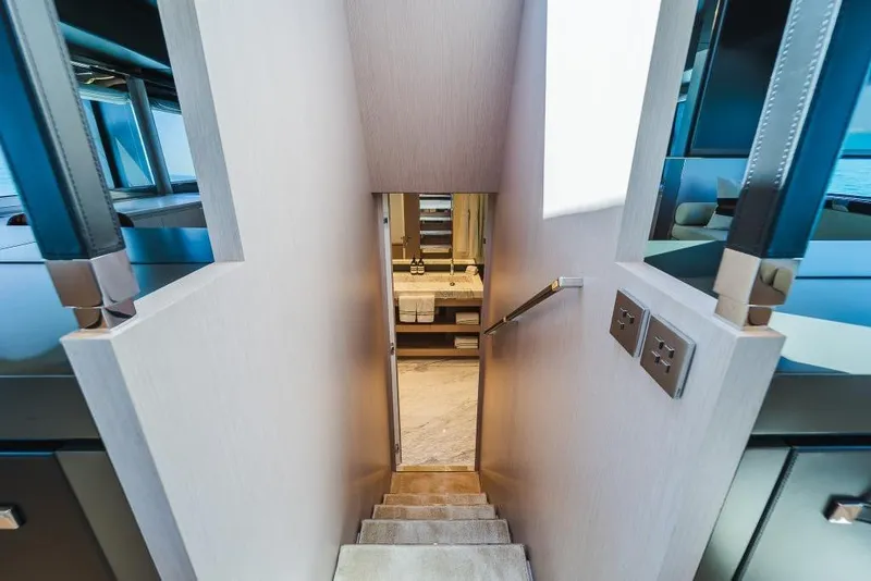 Slide: The Image of Interior staircase of 2022 Riva 90' Argo yacht, leading to luxurious cabin. - 18
