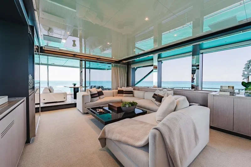 Slide: The Image of Luxurious interior of 2022 Riva 90' Argo yacht with ocean view and elegant furnishings. - 12